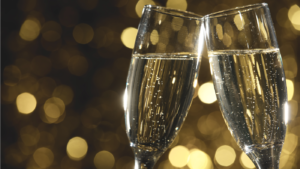 Flutes of champagne in holiday setting,Closeup. via Shutterstock
