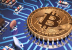 Concept Of Bitcoin Like A Computer Processor On Motherboard. via Shutterstock