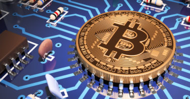 Concept Of Bitcoin Like A Computer Processor On Motherboard. via Shutterstock